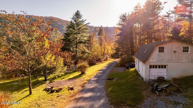 exterior space featuring a mountain view and a forest view