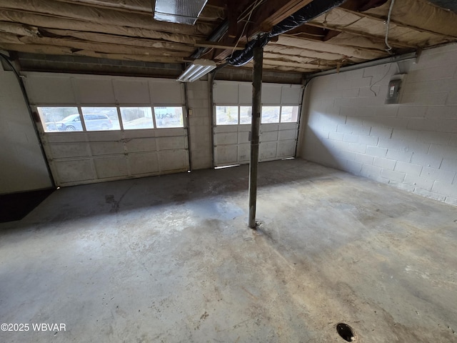 garage featuring concrete block wall