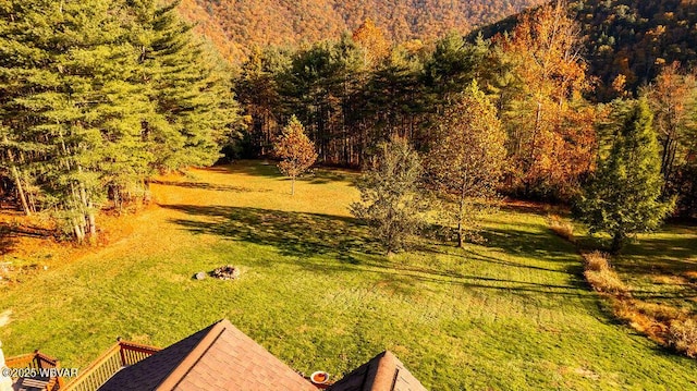 view of yard with a forest view