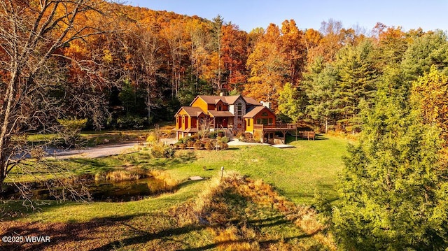 exterior space with a wooded view