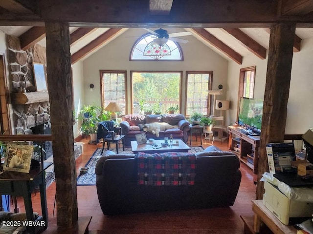 living room with lofted ceiling with beams and ceiling fan