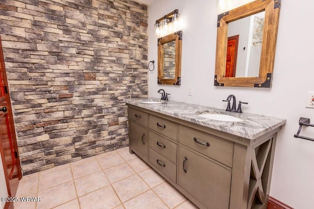 bathroom featuring a sink and double vanity