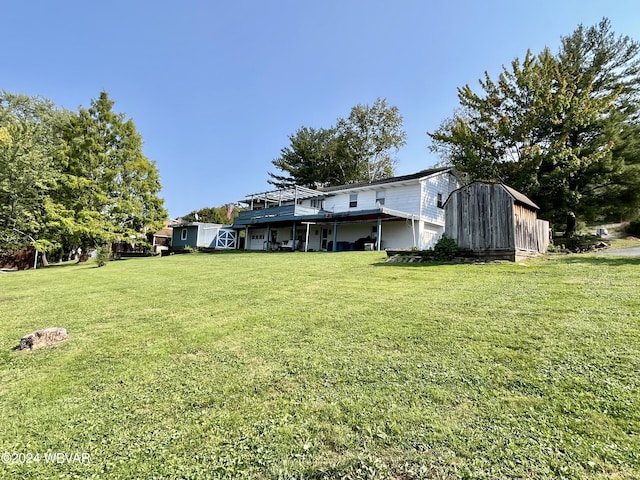 view of yard featuring a shed and a deck