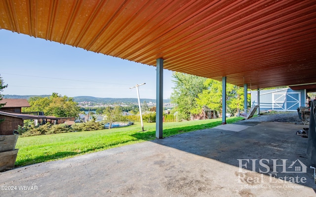 view of patio featuring a mountain view and an outdoor structure