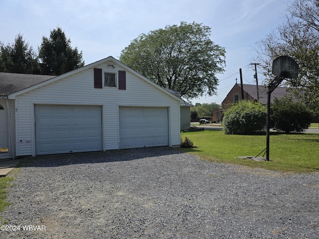 garage with a lawn