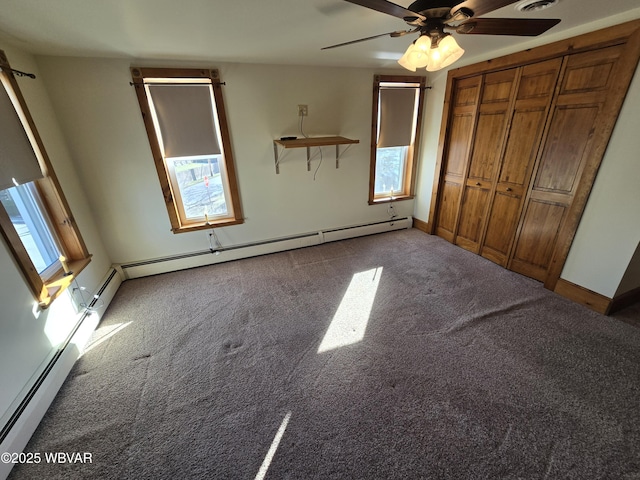 unfurnished bedroom with ceiling fan, a closet, carpet, and a baseboard radiator