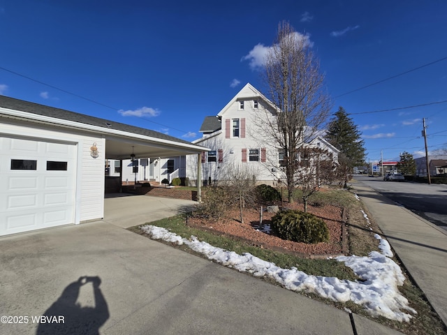 view of property exterior featuring a porch and a garage