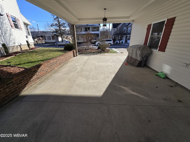 view of patio / terrace featuring covered porch and a grill