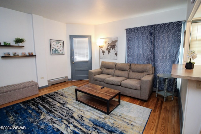 living room featuring hardwood / wood-style flooring and baseboard heating