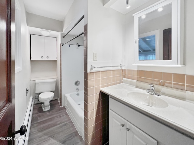 full bathroom with tub / shower combination, vanity, baseboard heating, hardwood / wood-style floors, and toilet