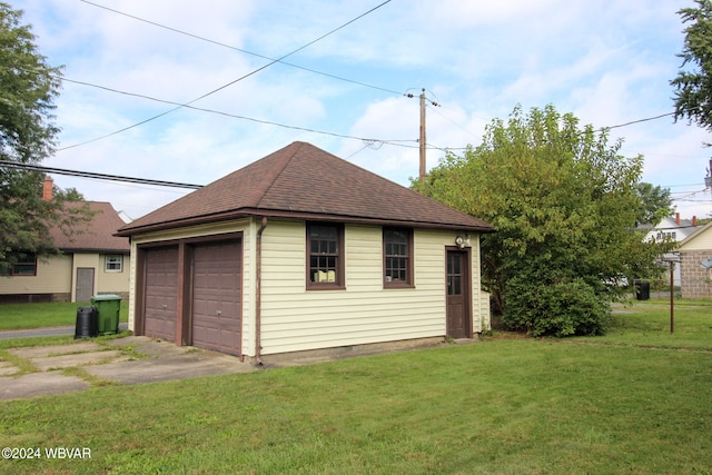 garage featuring a yard