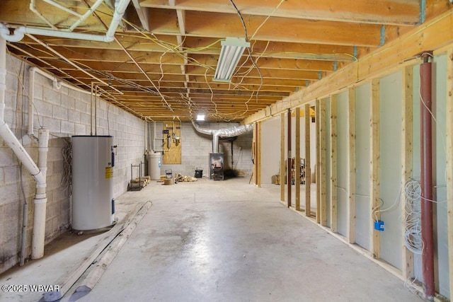 175 Hemlock Ln, Millville, PA 17846 - unfinished below grade area featuring water heater and concrete block wall