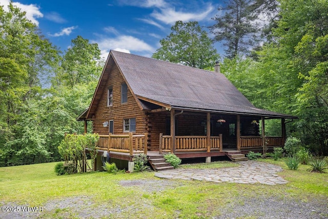 175 Hemlock Ln, Millville, PA 17846 - log home with a front lawn, log siding, a chimney, and roof with shingles