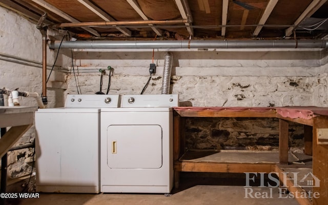 clothes washing area with washer and dryer and laundry area