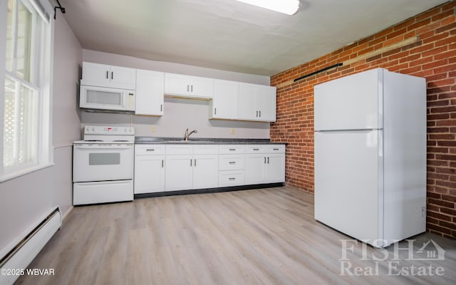 kitchen featuring brick wall, baseboard heating, white cabinets, light wood finished floors, and white appliances