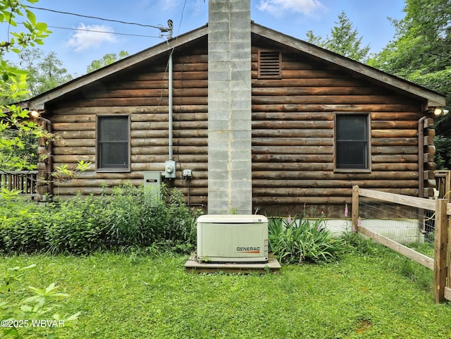 72 Carl Rd, Dushore, PA 18614 - view of side of property featuring log siding and a chimney