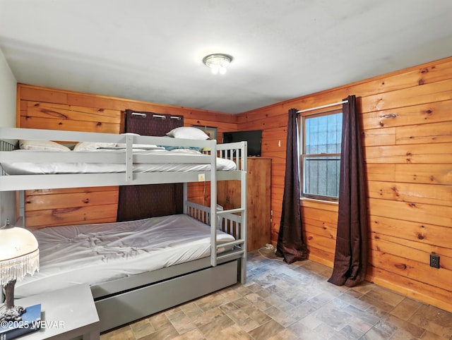 72 Carl Rd, Dushore, PA 18614 - bedroom with wooden walls and stone finish floors