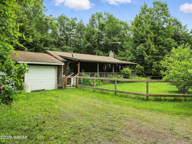 72 Carl Rd, Dushore, PA 18614 - view of front facade featuring a garage and a chimney