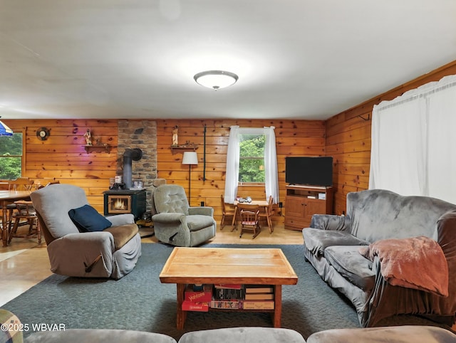 72 Carl Rd, Dushore, PA 18614 - living room with a wood stove, plenty of natural light, and wooden walls
