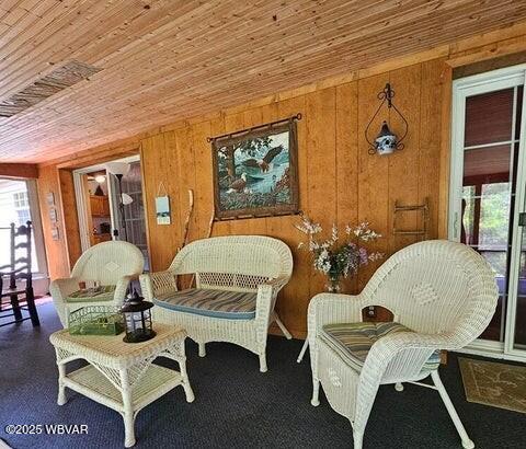 68 Sassafras Ln, Waterville, PA 17776 - sitting room with wooden walls and wooden ceiling