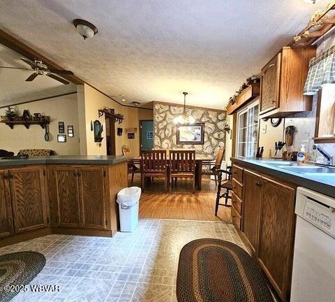 68 Sassafras Ln, Waterville, PA 17776 - kitchen featuring a textured ceiling, dark countertops, a sink, and dishwasher