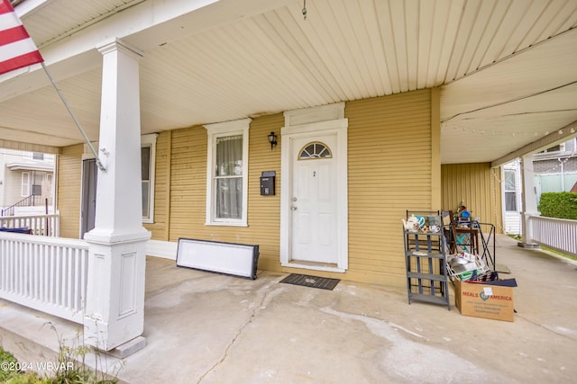 doorway to property featuring covered porch