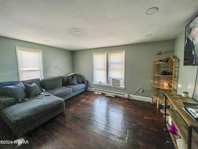 living room with dark hardwood / wood-style floors, cooling unit, a wealth of natural light, and a baseboard radiator