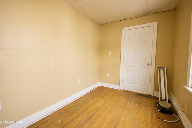 spare room with hardwood / wood-style flooring