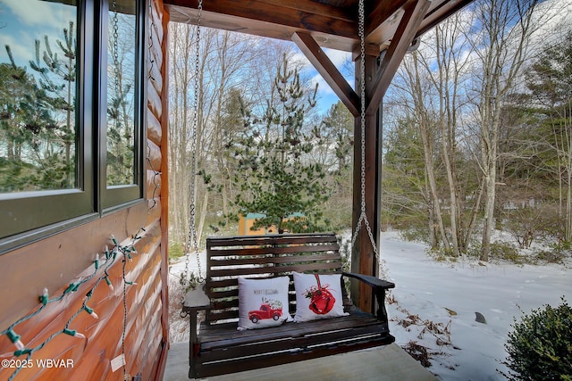 view of snow covered deck