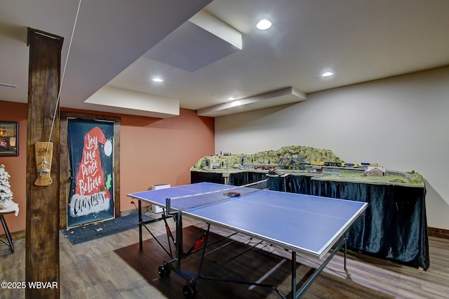 game room featuring dark hardwood / wood-style floors