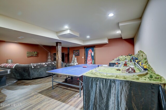 game room with hardwood / wood-style floors