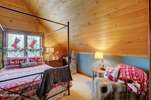 carpeted bedroom featuring vaulted ceiling and wood ceiling