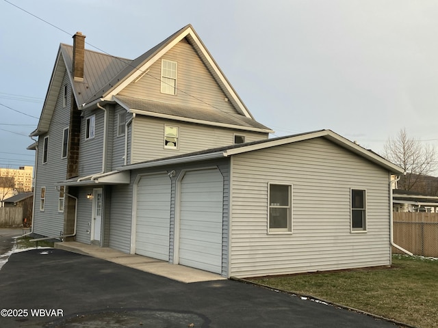 view of side of property featuring a garage