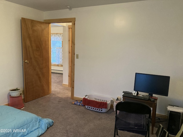 bedroom featuring carpet and a baseboard heating unit