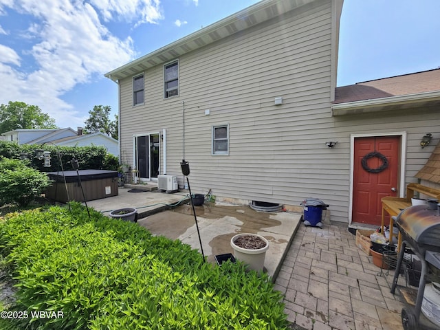 131 Walnut Ln, Jersey Shore, PA 17740 - rear view of property featuring a hot tub and a patio