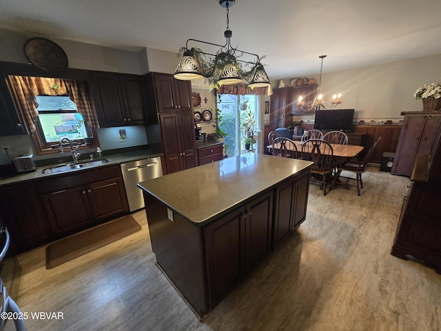 131 Walnut Ln, Jersey Shore, PA 17740 - kitchen with stainless steel dishwasher, a chandelier, light wood finished floors, a kitchen island, and decorative light fixtures