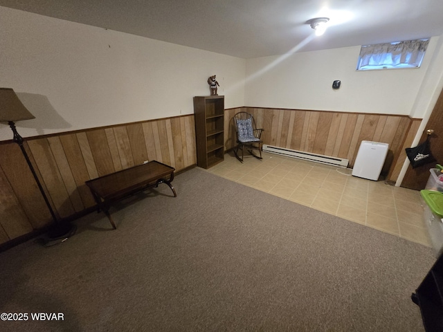 131 Walnut Ln, Jersey Shore, PA 17740 - living area with baseboard heating, wainscoting, wood walls, light carpet, and light tile patterned floors
