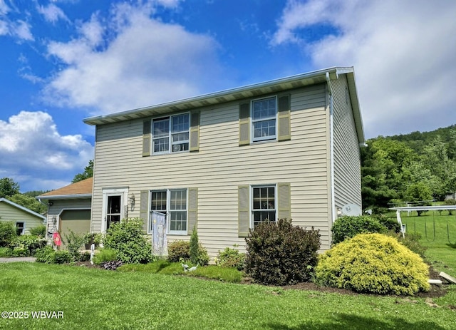 131 Walnut Ln, Jersey Shore, PA 17740 - view of front of house featuring a garage and a front lawn
