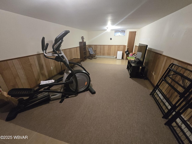 131 Walnut Ln, Jersey Shore, PA 17740 - workout area with wainscoting, wooden walls, carpet flooring, and a baseboard heating unit
