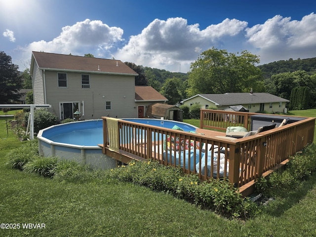 131 Walnut Ln, Jersey Shore, PA 17740 - swimming pool with a storage unit, a wooden deck, and a lawn