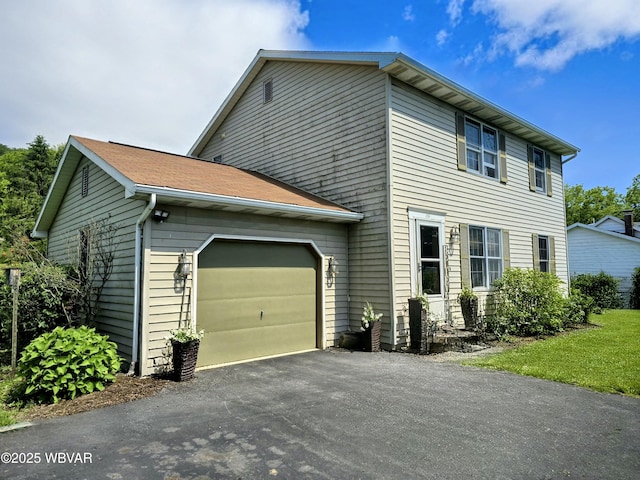 131 Walnut Ln, Jersey Shore, PA 17740 - view of side of property featuring an attached garage and driveway