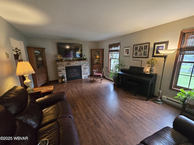 131 Walnut Ln, Jersey Shore, PA 17740 - living area featuring a fireplace, wood finished floors, and baseboard heating