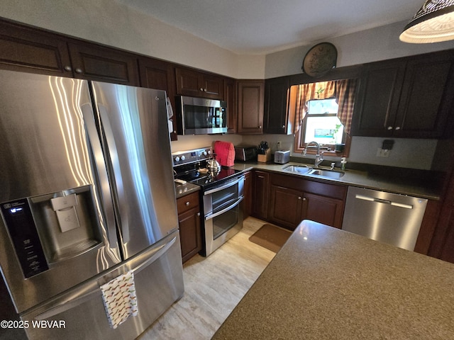 131 Walnut Ln, Jersey Shore, PA 17740 - kitchen with appliances with stainless steel finishes, dark brown cabinetry, and light flooring