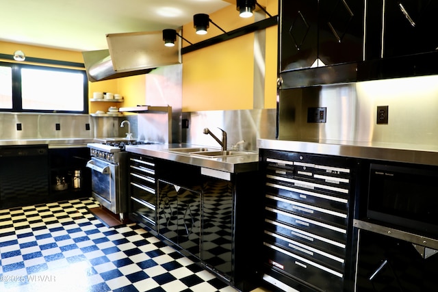 3630 Linn St, Cogan Station, PA 17728 - kitchen featuring stainless steel counters, high end range, dark cabinetry, and dark floors