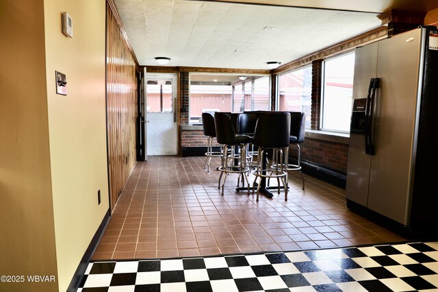 3630 Linn St, Cogan Station, PA 17728 - dining space featuring dark floors and brick wall