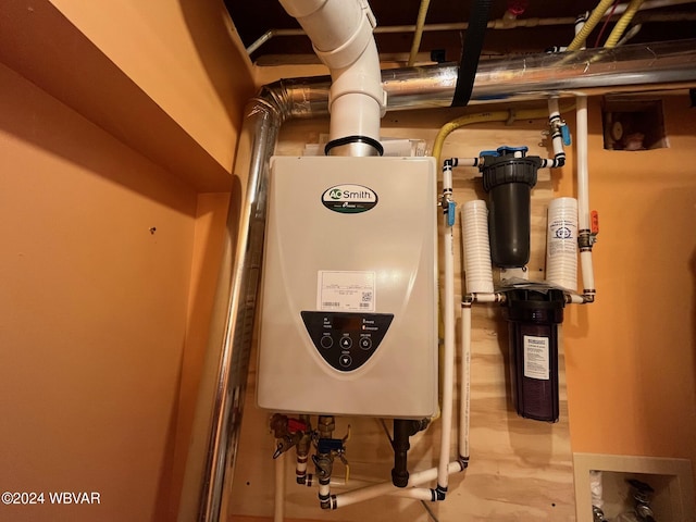 utility room featuring tankless water heater