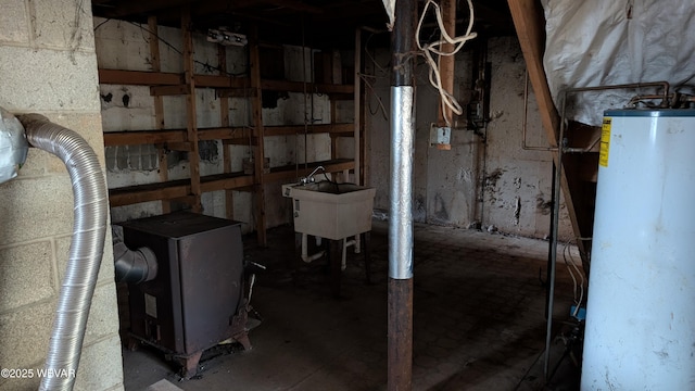 unfinished basement with water heater and a sink