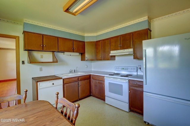443 Derr Hill Rd, Lock Haven, PA 17745 - kitchen with white appliances, under cabinet range hood, a sink, brown cabinetry, and light countertops