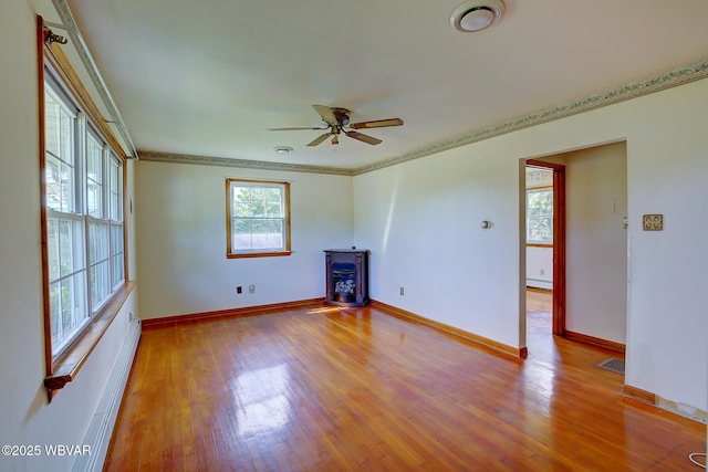 443 Derr Hill Rd, Lock Haven, PA 17745 - unfurnished living room with ceiling fan, wood finished floors, baseboards, ornamental molding, and a baseboard radiator