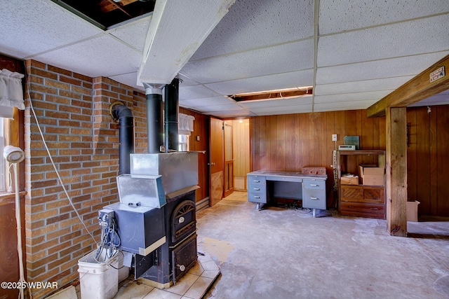 443 Derr Hill Rd, Lock Haven, PA 17745 - finished basement featuring a wood stove, wood walls, and a drop ceiling